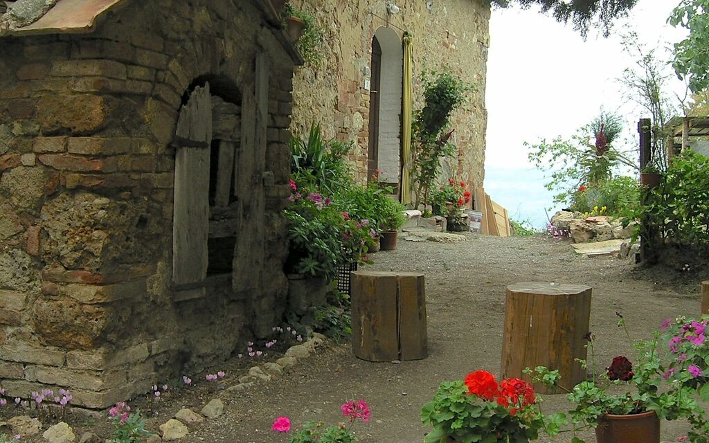 Characteristic old home and flowers in Tuscany