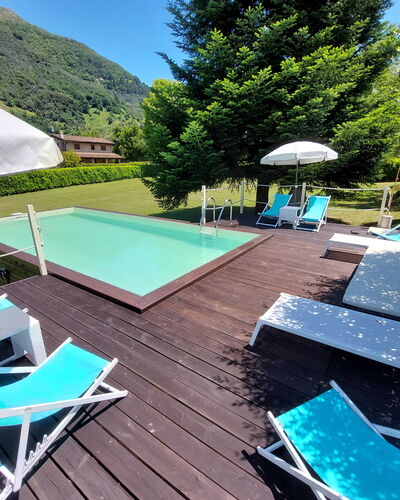 Villa L'antico Casale: Propriété, Meubles, L'Eau, Parapluie, Piscine, Ciel, Vert, Bleu, Bleu Azur, Ombre